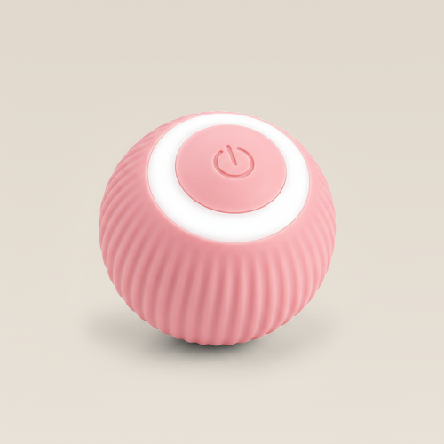 Pink BouncePro ribbed rolling cat ball on a warm cream studio background